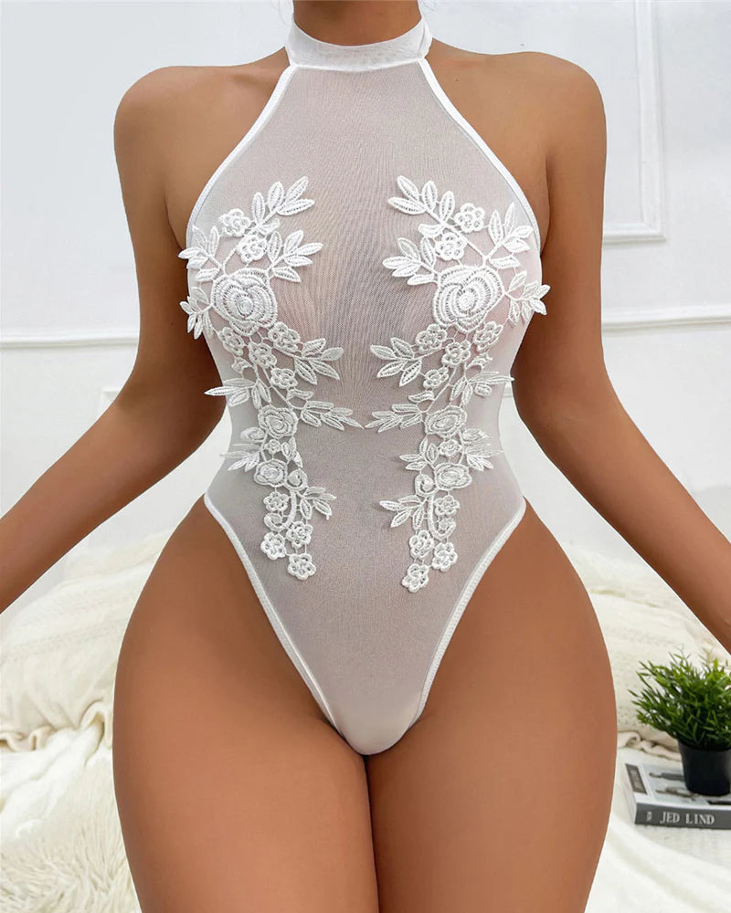 Body cuello halter, transparente. Con bordado floral